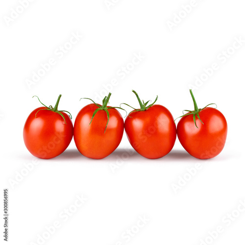 Whole red four tomatoes with green branch isolated on white background side view. Healthy organic vitamin plant tomato exhibited in one line close up photo
