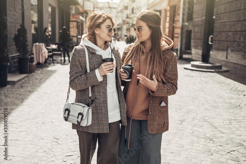 Portrait of Two Fashion Girls, Best Friends Outdoors, Coffee Break Lunch at Sunny Day