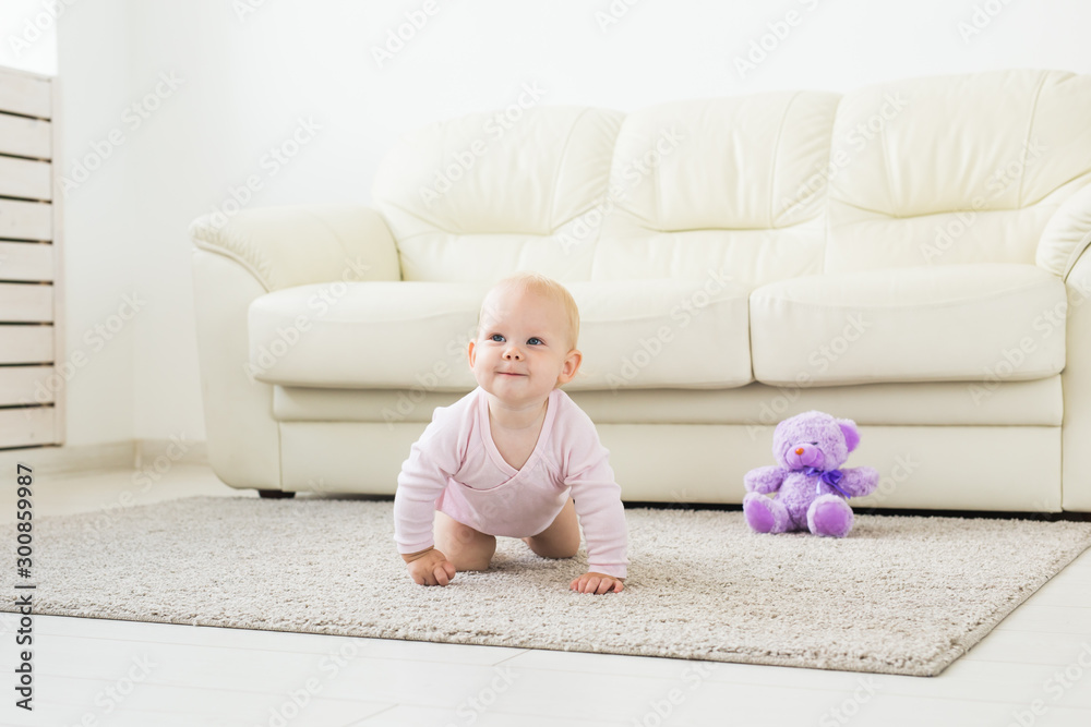 beautiful smiling baby crawling for the first time. beautiful smiling baby crawling for the first time.