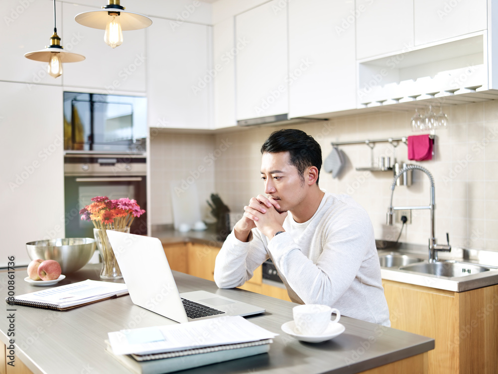 young asian man working from home