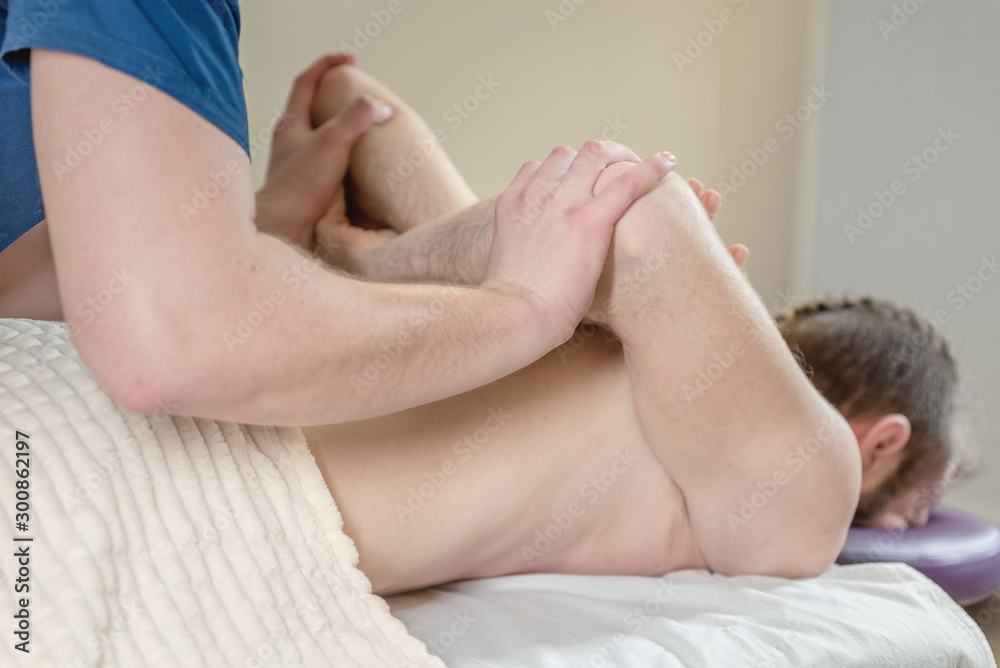 Masseur makes massage to the patient. Massage in a medical institution. Masseur makes massage to the patient. Massage in a medical institution.