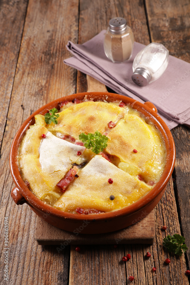 tartiflette, french dish with potato, bacon and cheese tartiflette, french dish with potato, bacon and cheese