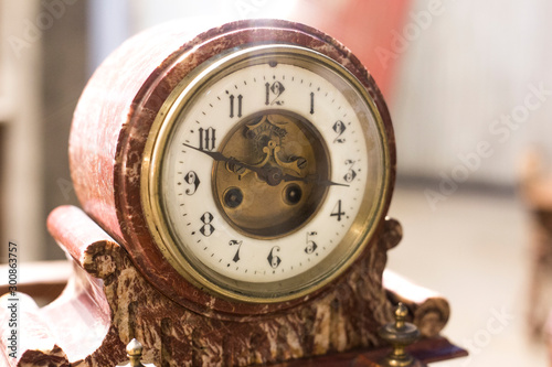 Old antique clock showing the time