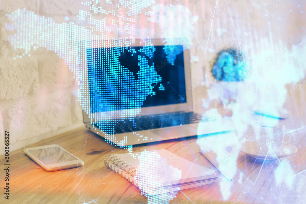 Stock market graph on background with desk and personal computer. Multi exposure. Concept of financial analysis.