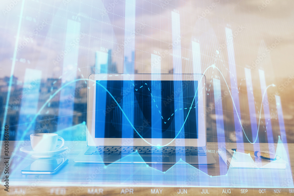 Forex Chart hologram on table with computer background. Multi exposure. Concept of financial markets. Forex Chart hologram on table with computer background. Multi exposure. Concept of financial markets.