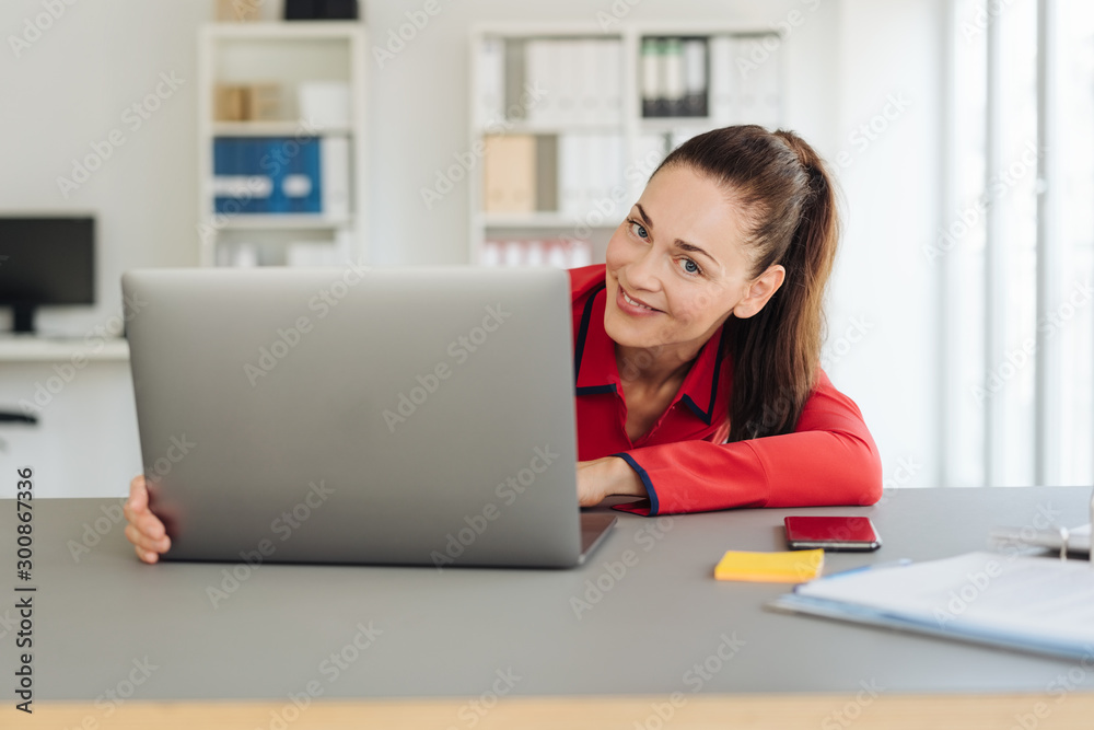 Playful young businesswoman with a lovely smile Playful young businesswoman with a lovely smile