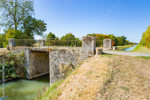 Fototapeta Naklejka Na Ścianę i Meble -  Bridge over the Canal de Berry in Centre-Val de Loire, France