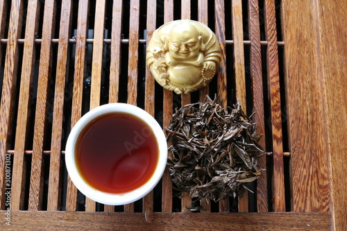 Chinese tea ceremony using tea utensils made of glass, clay and porcelain.