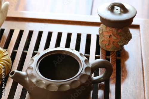 Chinese tea ceremony using tea utensils made of glass, clay and porcelain.