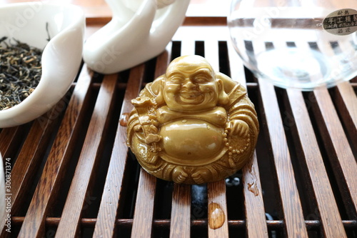 Chinese tea ceremony using tea utensils made of glass, clay and porcelain.