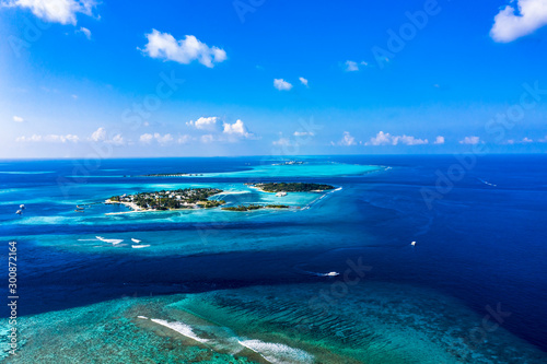 Aerial view, Maldives island Kandooma and Guraidhoo lagoon, South Male Atoll, Maldives photo