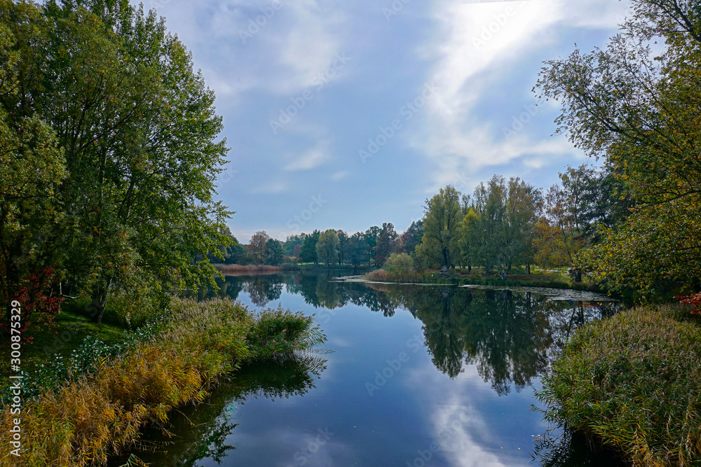 beautiful lakeside with trees and refelctions in autumn