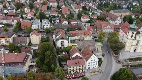 Aerial view of Donaueschingen in Germany, on a sunny day in autumn. Pan to the right besidea  church in Donaueschingen. photo