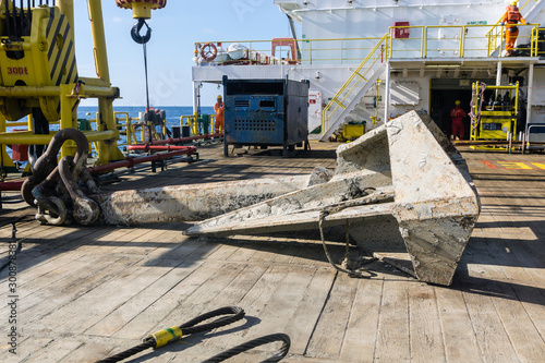 Anchor laid on deck of a construction barge at oil field