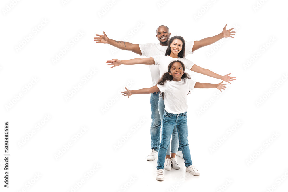 cheerful african american family imitating flying with outstretched hands on white background