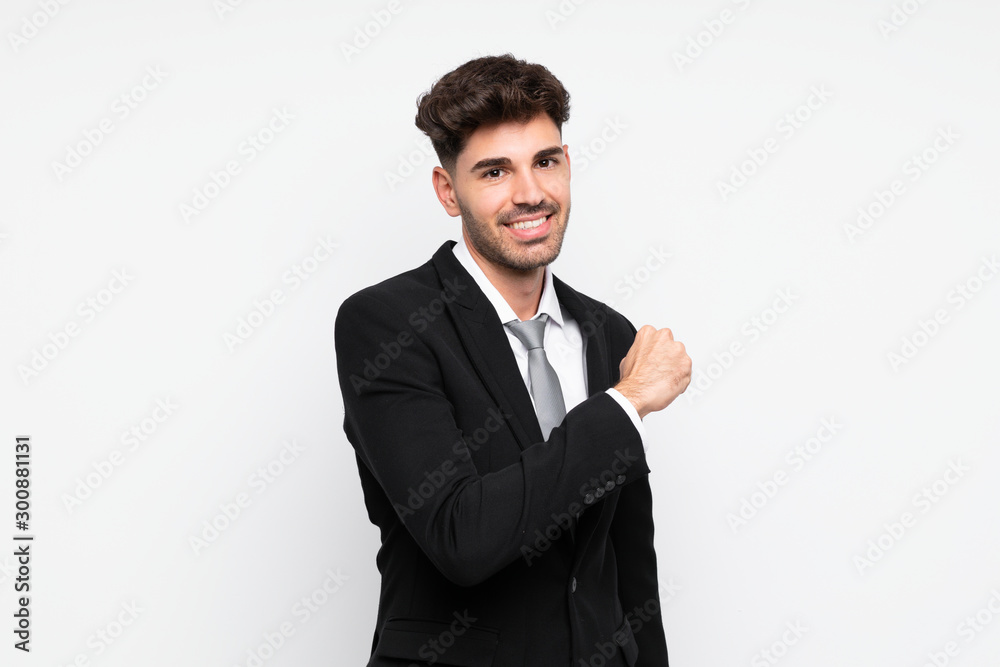 Young businessman over isolated white background celebrating a victory