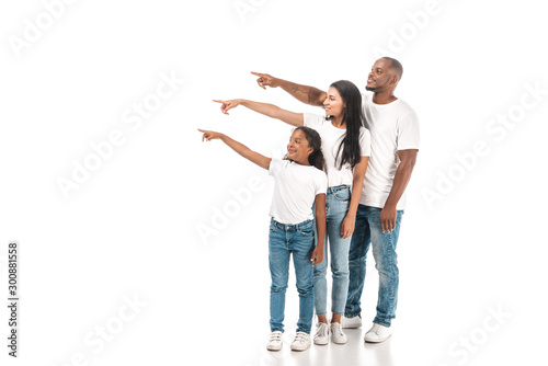 african american mother, father and daughter pointing with fingers and looking away on white background