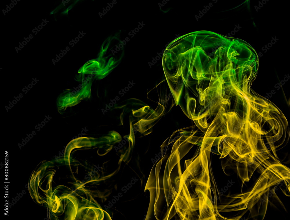 Fototapeta premium Colored smoke on black background