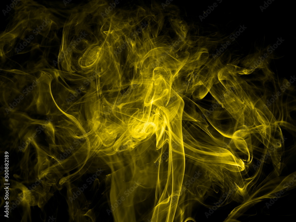 Yellow smoke on black background Yellow smoke on black background