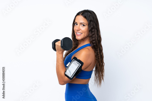 Young sport woman over isolated white background making weightlifting