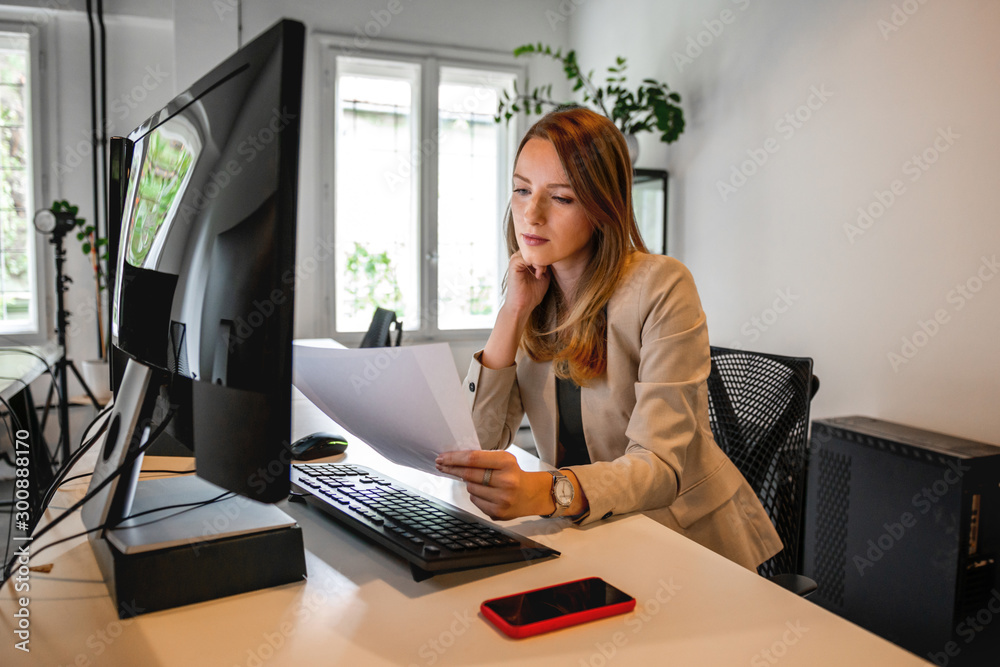Young woman working in office Young woman working in office