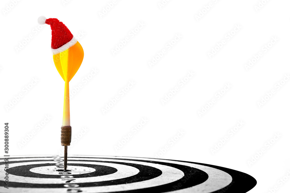 target dart with arrow and Christmas cap isolated on white background ,image for Christmas holiday target marketing concept . target dart with arrow and Christmas cap isolated on white background ,image for Christmas holiday target marketing concept .