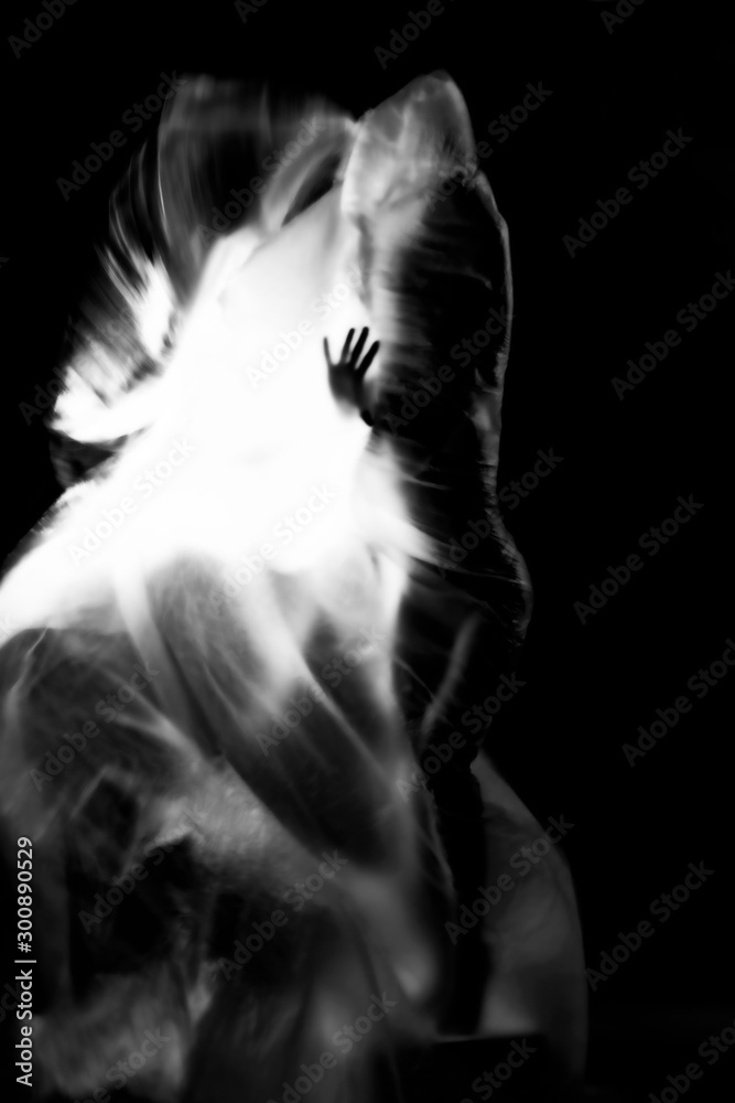 Conceptual monochrome black and white avant-garde portrait of a beautiful young girl covered with lines applied by a light brush. Art style creative photo. Advertising, fashion and commercial design.