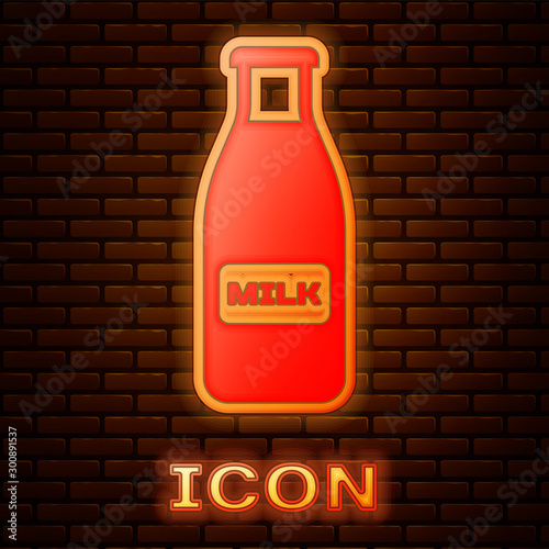 Glowing neon Closed glass bottle with milk and cap icon isolated on brick wall background. Vector Illustration