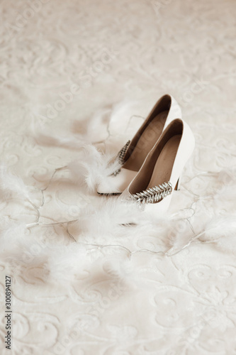 Wedding accessories bride on the wedding day. White wedding shoes for women. Bride wedding shoes. Bridal morning preparations.