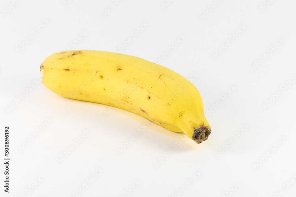 Single yellow banana in a white back ground Single yellow banana in a white back ground
