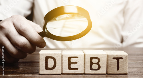 Fotografie, Tablou Businessman explores debt