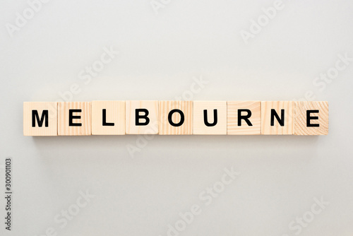 top view of wooden blocks with Melbourne lettering on grey background