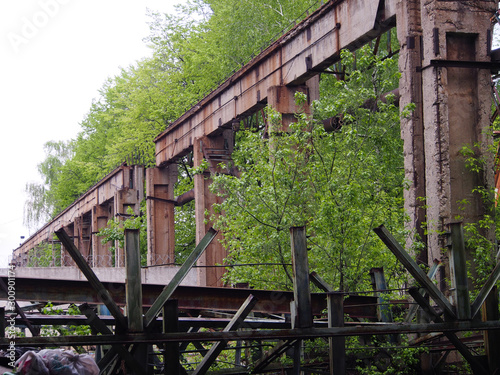 Collapsing farm bridge crane at an abandoned factory.