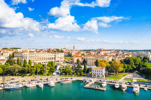 Croatia, city of Pula, ancient Roman arena, historic amphitheater and old town center from drone, aerial view © ilijaa