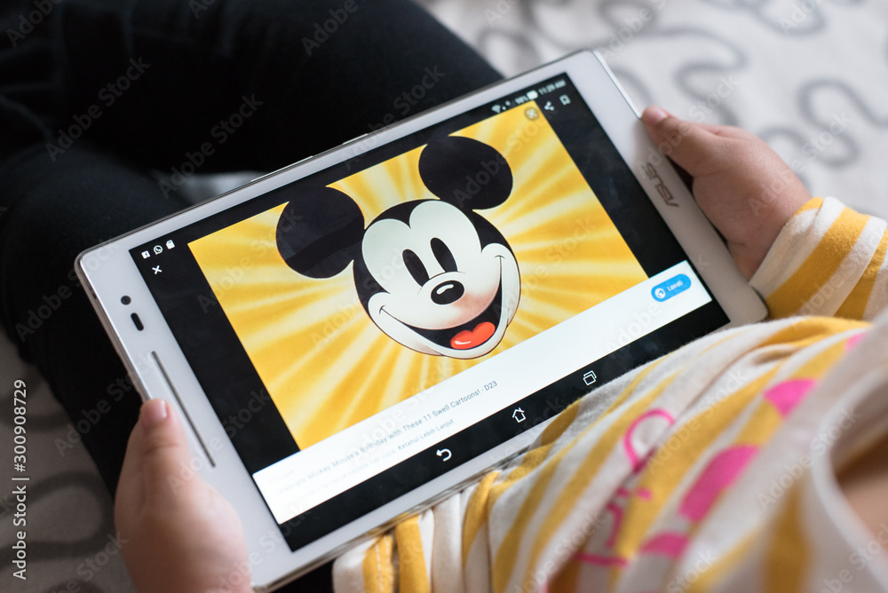 Petaling Jaya,Selangor,Malaysia - 03 November 2019 : Litlle girl watching mickey  mouse educational program video on youtube using digital tablet. Mickey  Mouse is a famous cartoon character from Disney Stock Photo | Adobe Stock