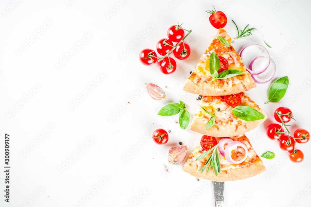 Pieces of cheese pizza Margarita, set like christmas tree. White stone background top view. Christmas and New year party food idea