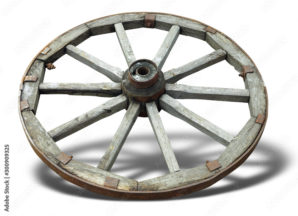 Old brown wooden wagon wheel from a cart isolated over white