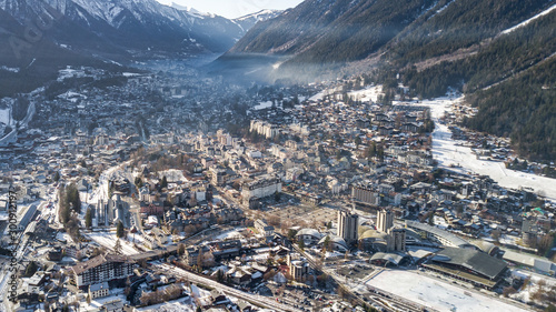 Photos Aerial drone view of snow covered Chamonix city in the afternoon