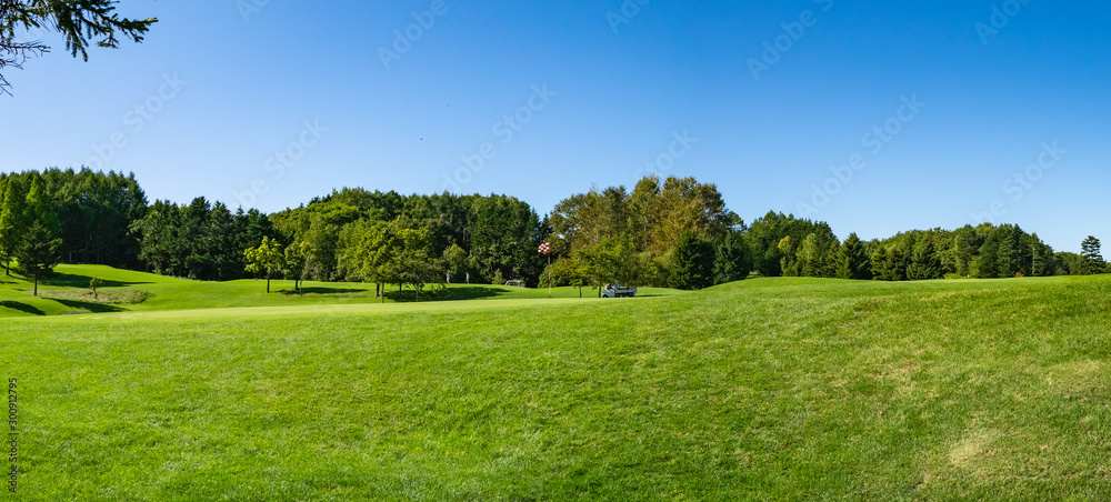 Panorama View of Golf Course with beautiful putting green. Golf course with a rich green turf beautiful scenery. Panorama View of Golf Course with beautiful putting green. Golf course with a rich green turf beautiful scenery.