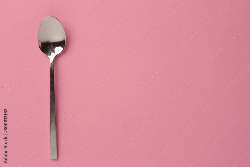 silver spoon isolated on colorful background silver spoon isolated on colorful background