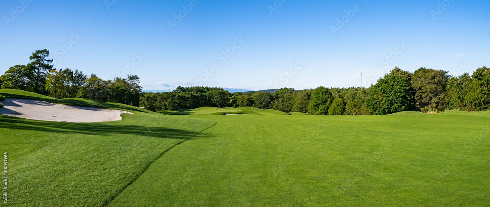 Golf Course with beautiful green field. Golf course with a rich green turf beautiful scenery.