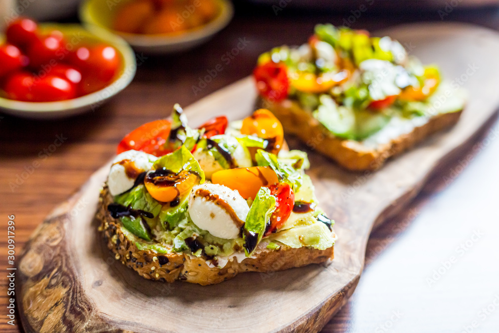 Toasts with Cherry Tomatoes, Mozzarella Cheese, Basil Leaves and Balsamic Sauce Toasts with Cherry Tomatoes, Mozzarella Cheese, Basil Leaves and Balsamic Sauce