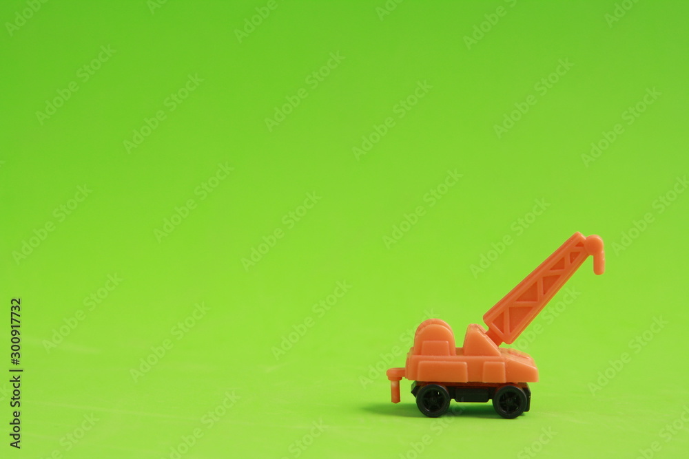 plastic toy with crane shape in color background plastic toy with crane shape in color background