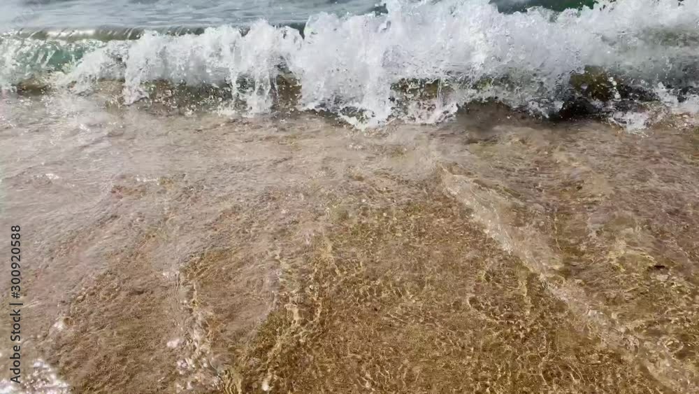 Blue sea waves on the sandy beach in the daytime 4K Blue sea waves on the sandy beach in the daytime 4K