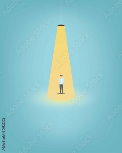 Business hiring and recruitment vector concept with businessman standing in bright yellow spotlight. Symbol of new career, headhunting, employment, new opportunity. Eps10 vector illustration.