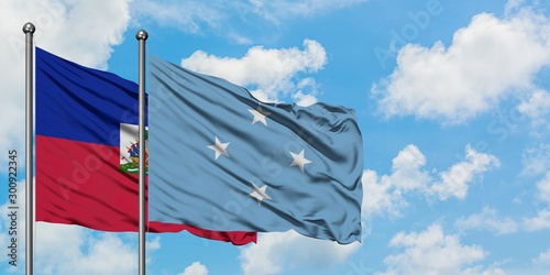 Εκτύπωση καμβά Haiti and Micronesia flag waving in the wind against white cloudy blue sky together