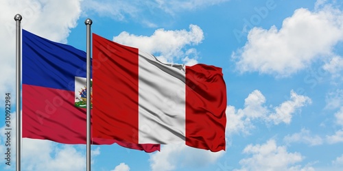 Εκτύπωση καμβά Haiti and Peru flag waving in the wind against white cloudy blue sky together