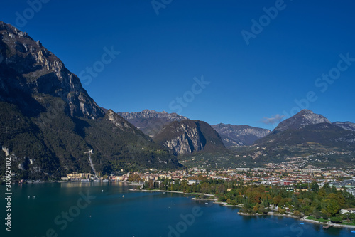 Aerial view of the city of Riva del Garda, Italy. Panoramic view of Lake Garda in the foreground, the city is surrounded by rocks and alpine mountains. Autumn season. © Berg