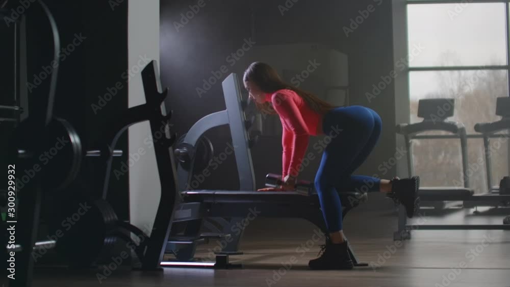 The young girl is training her back on the bench The young girl is training her back on the bench