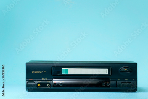 VHS video recorder Retro video recorder with video cassette on a light background . photo